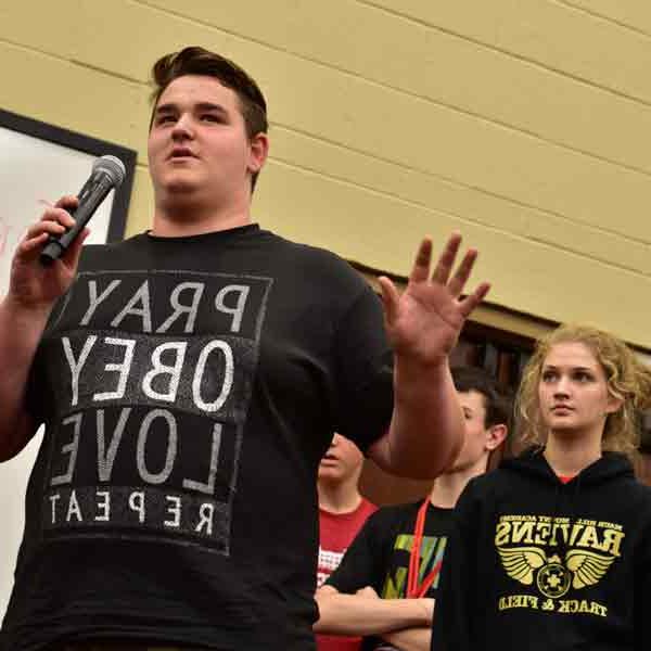 A BCYC participant speaks using a microphone